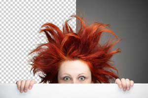 Redhead woman with messy hair against gray background